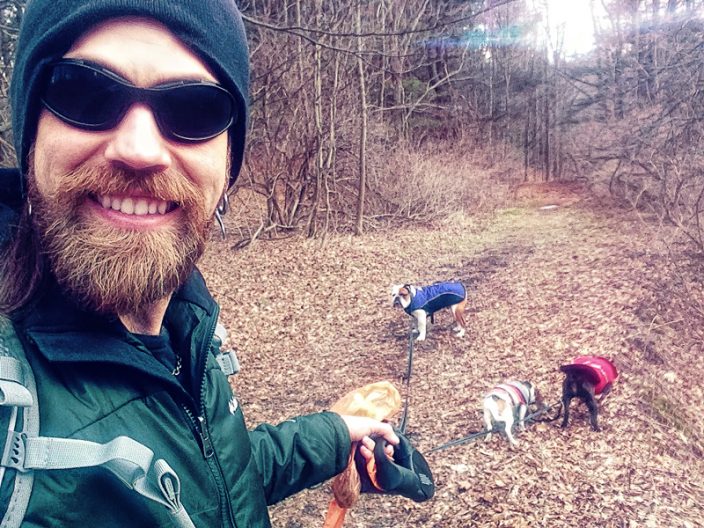 Ian Stone hiking with his dogs